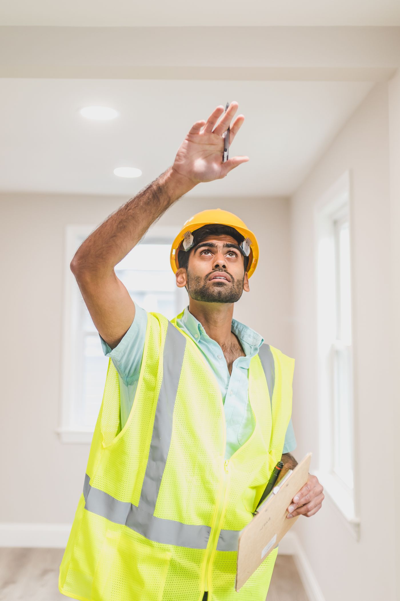 Construction professional inspecting a renovated residential interior